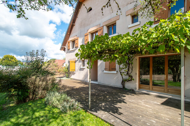 Renovated 19th-century farmhouse with adjoining barn offering great potential.