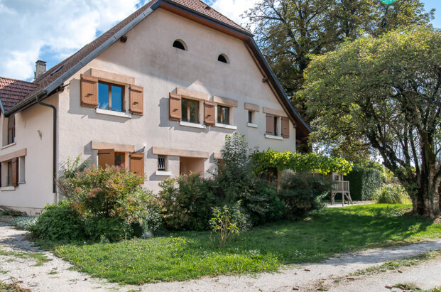Renovated 19th-century farmhouse with adjoining barn offering great potential.
