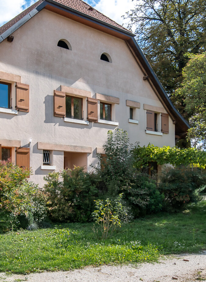 Renovated 19th-century farmhouse with adjoining barn offering great potential.